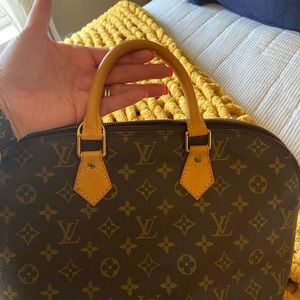 Authentic Louis Vuitton Alma handbag